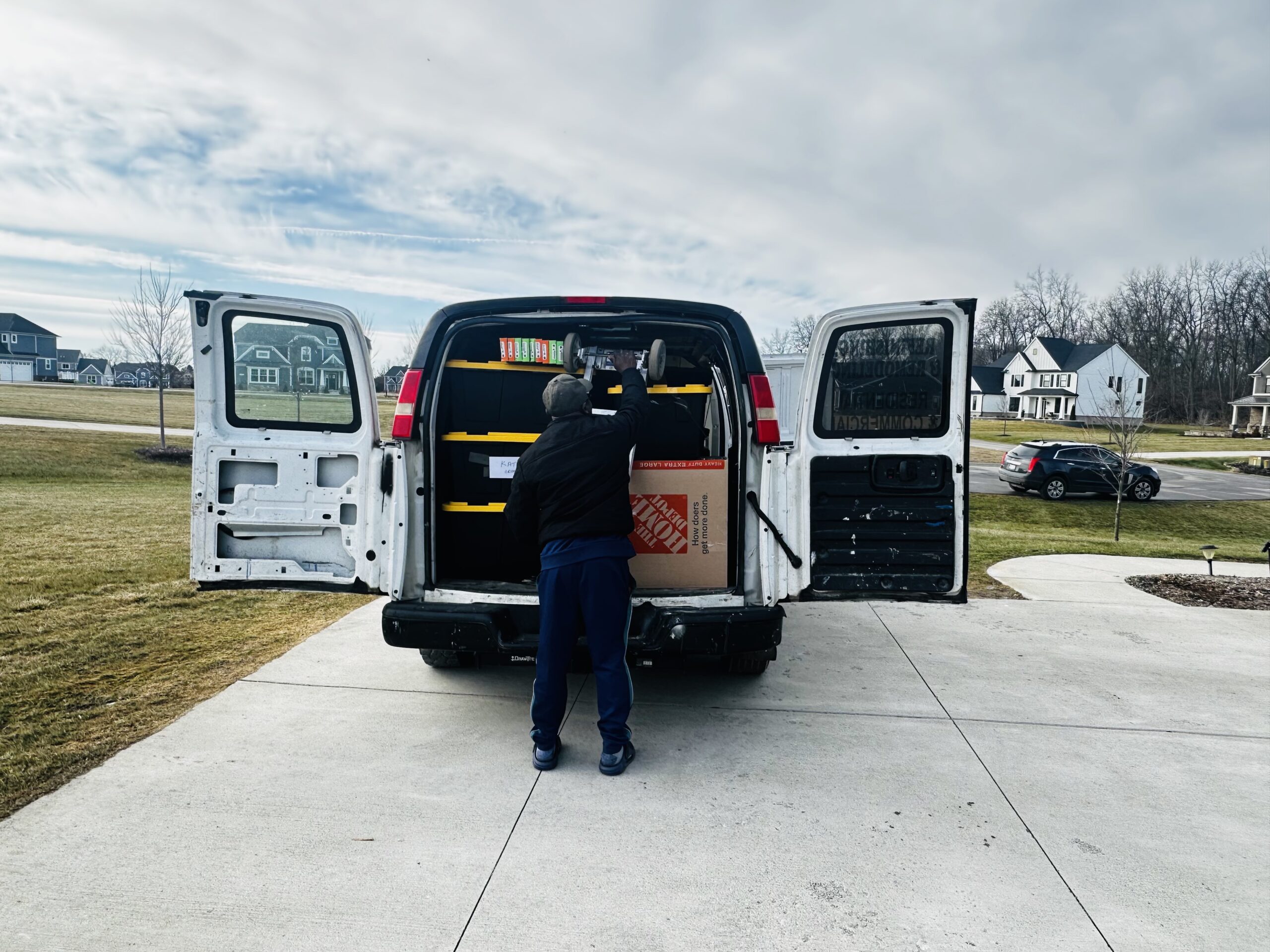 Loading medical supplies into a cargo van in Michigan
